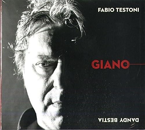 CD cover featuring a close-up, shadowed portrait of a man.