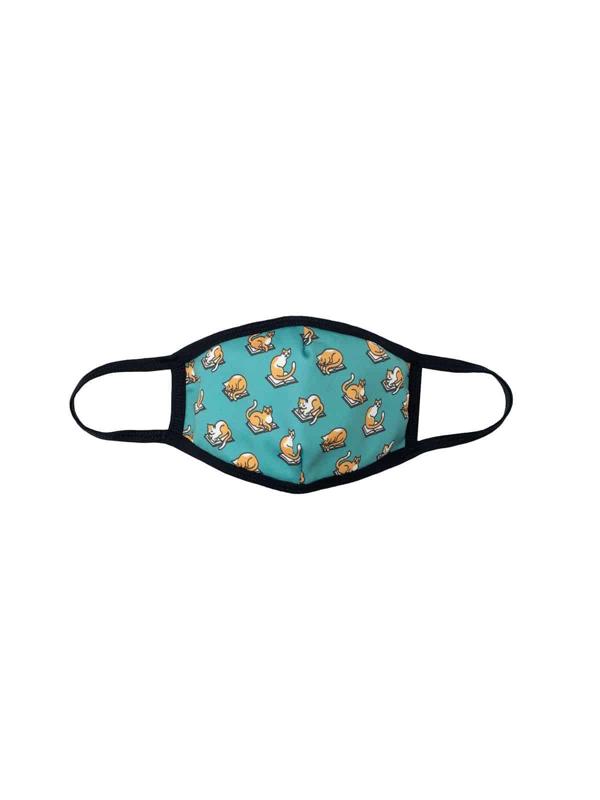 Blue face mask with repeating pattern of cats reading books.