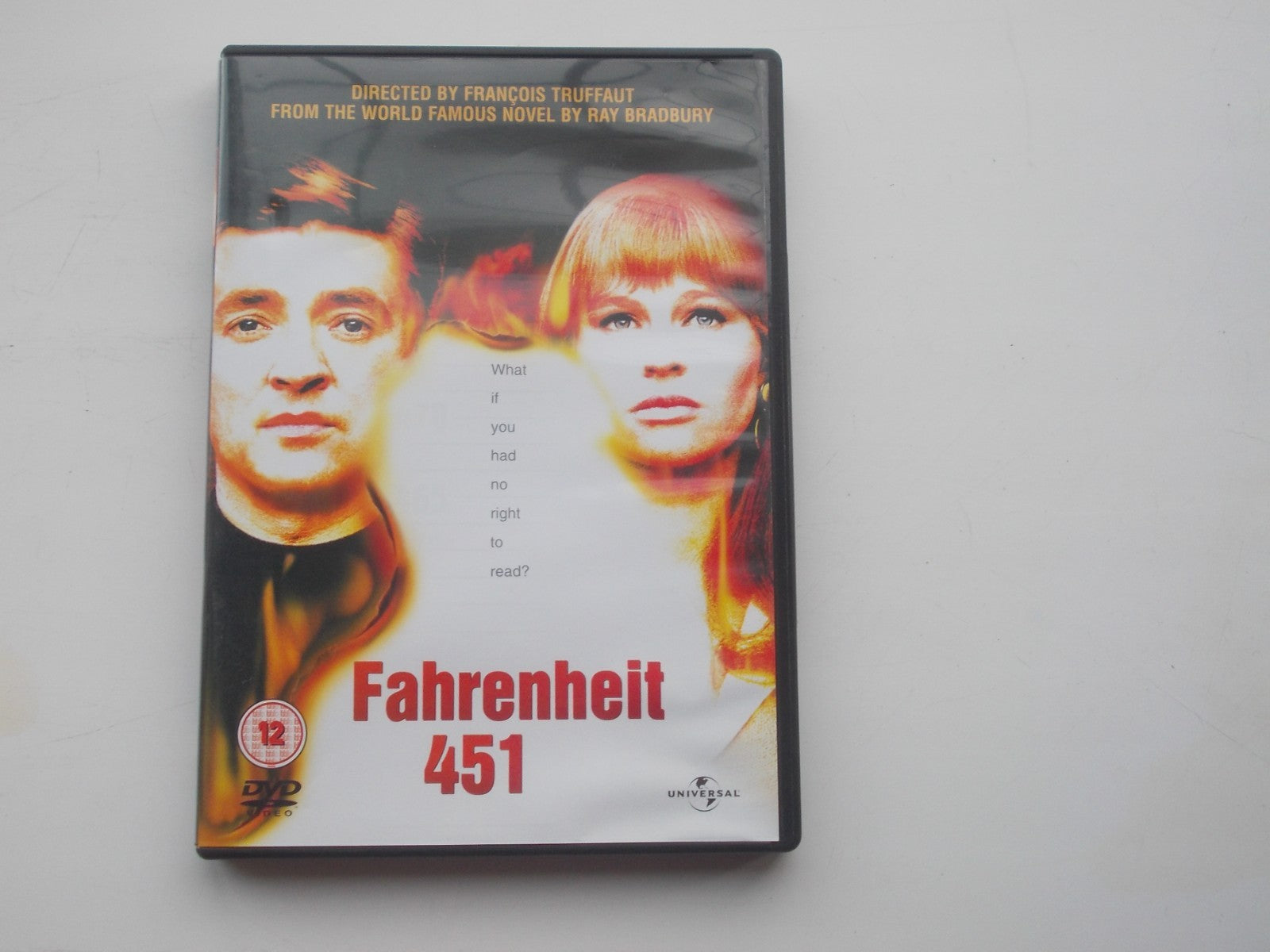DVD cover for "Fahrenheit 451" featuring two faces split by flames.