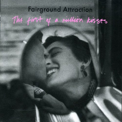 Black and white photo of a smiling woman, album cover art.