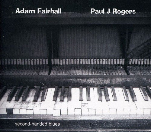 CD cover: weathered piano keys, black and white, with artist names.
