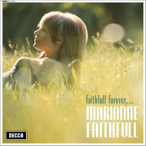 AlbumLLB Profile of Marianne Faithfull in a sunlit field of tall grass.