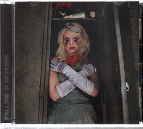 CD cover: woman with smeared makeup holding a red rose in a locker.