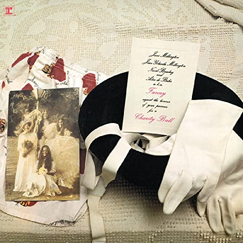 Record cover with vintage photo, gloves, and a red floral pattern.