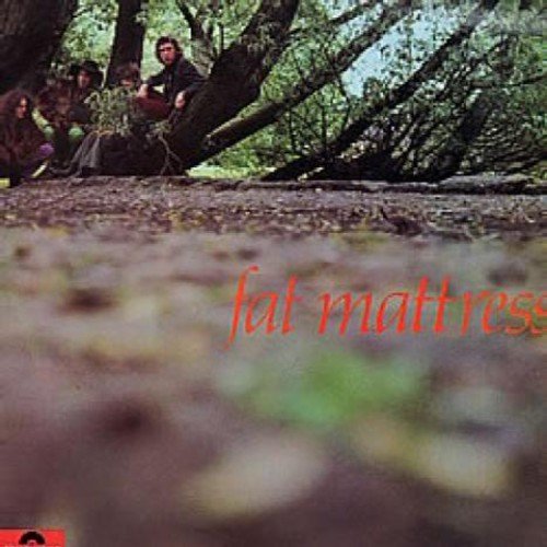 "Album cover with 'fat mattress' in red text, featuring a forest scene with people."