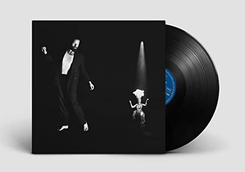 Father John Misty album cover and black vinyl record shown.