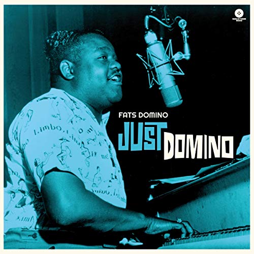 Fats Domino at a piano with microphone, album cover for "Just Domino".