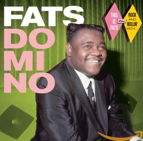 CDB&W photo of Fats Domino smiling in a suit against a green curtain background.