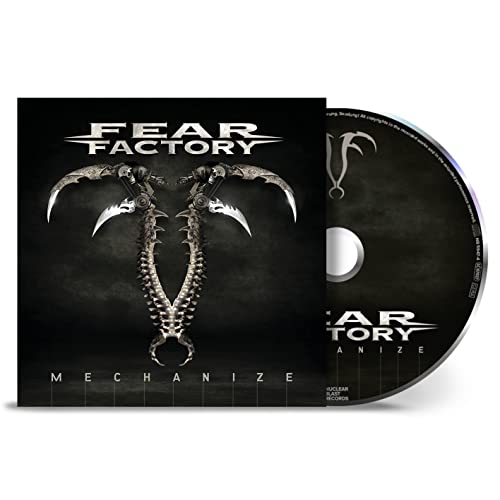 Fear Factory’s “Mechanize” CD case with robotic claw design and disc.