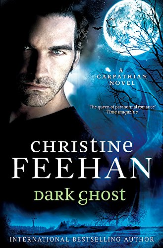 Book cover: dark-haired man, moonlit landscape, and title "Dark Ghost" by Christine Feehan.
