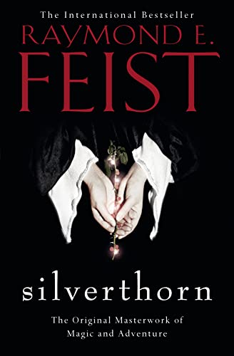Book cover for "Silverthorn" by Raymond E. Feist, featuring hands holding a rose.