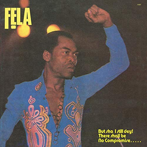 Vinyl record cover featuring Fela Kuti in a blue embroidered shirt, fist raised.
