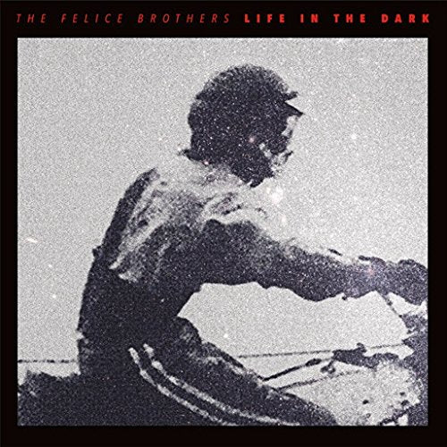 Album cover with a man riding a motorcycle, black and white image with red text.