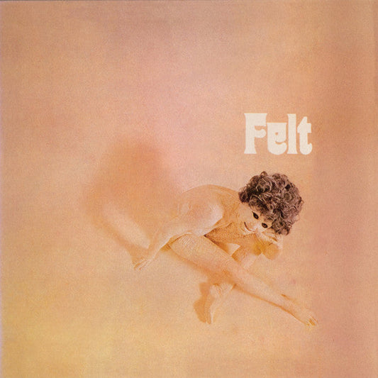 Album cover for Felt, featuring a person mid-air on a peach background.
