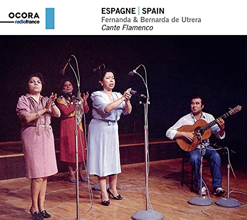 Flamenco singers Fernanda & Bernarda de Utrera performing with a guitarist.