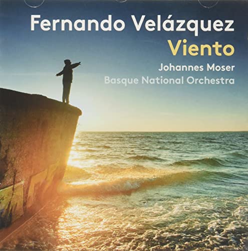 CD cover: Silhouette on a cliff overlooking the ocean at sunset.