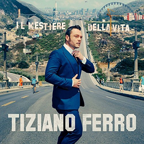 Tiziano Ferro album cover: man in a suit on a bridge, city backdrop.