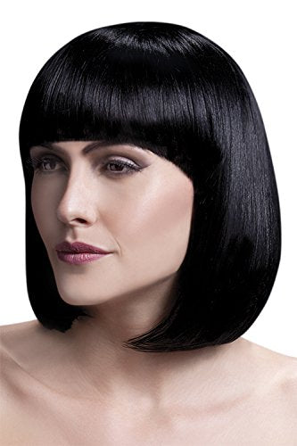 Woman wearing a black bob wig with bangs against a dark blue background.