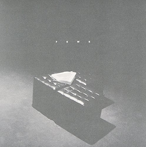 Black and white album cover for "Fews - The Zoo" with a geometric sculpture.