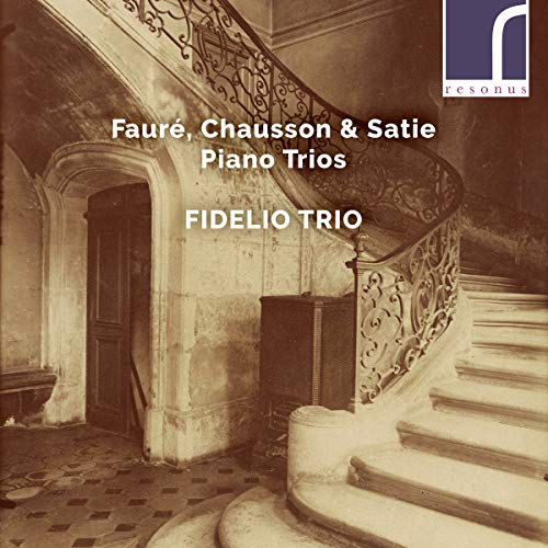 CD cover with ornate staircase, text listing composers and “Fidelio Trio”.