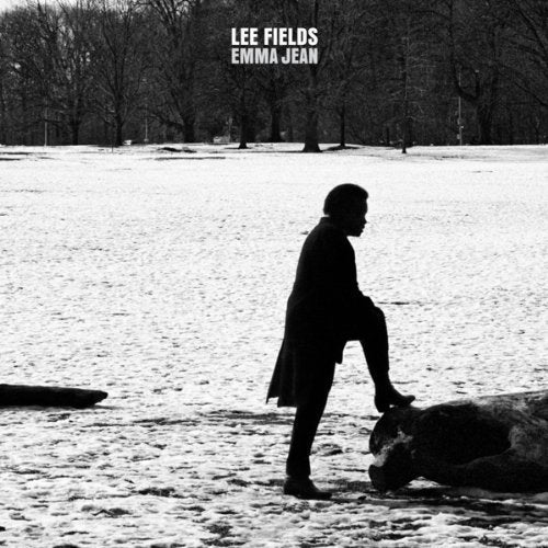 Black and white album cover with a man standing on a log in a snowy field.