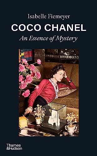 Book cover featuring a portrait of Coco Chanel in red, with flowers.