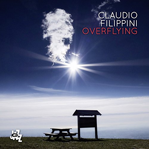 CD cover: hilltop picnic area under a bright sun and clouds.
