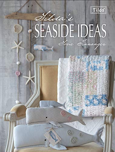 Book cover with seaside crafts: whale plush, starfish, and quilt.
