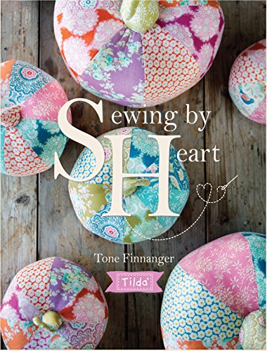 Book cover with colorful patchwork heart-shaped cushions and title text.