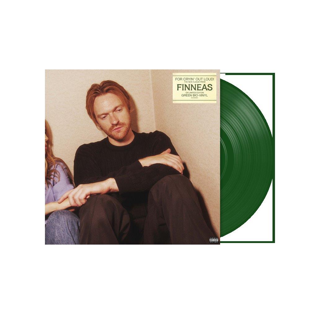 Finneas album cover featuring a man sitting next to a green vinyl record.