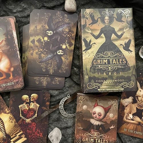 Dark fantasy tarot deck with gothic imagery, skulls, and a guidebook.