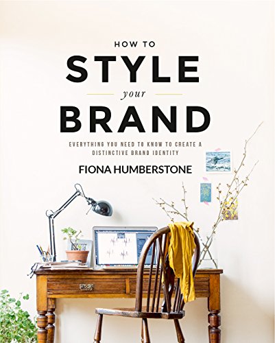 Book cover with bold title, desk scene, and chair with yellow cloth.