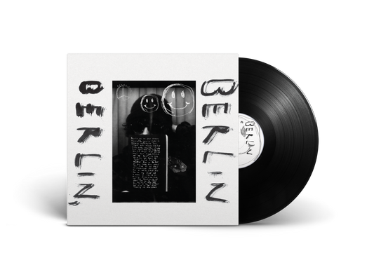 Vinyl record and white album cover with black and white portrait.