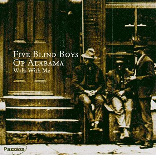 Vintage photo of three men in suits seated on steps, album cover.