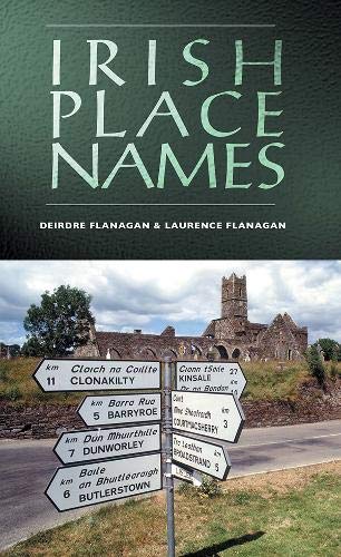 Book cover titled Irish Place Names showing a bilingual road sign and stone ruins.