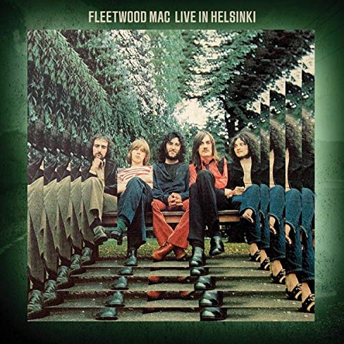 Fleetwood Mac album cover: band members seated on steps in nature.