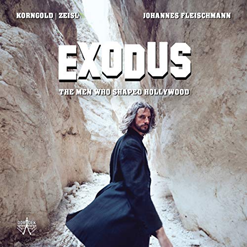"CD cover with man in dark robe standing between rocky cliffs, titled 'EXODUS'."