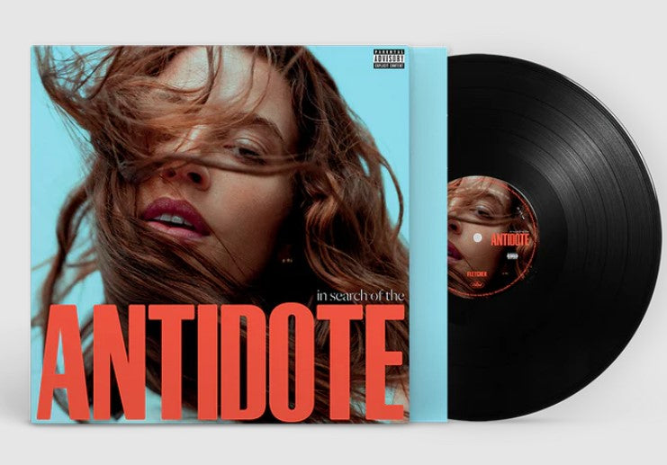 Vinyl record and album cover featuring a portrait of a woman.