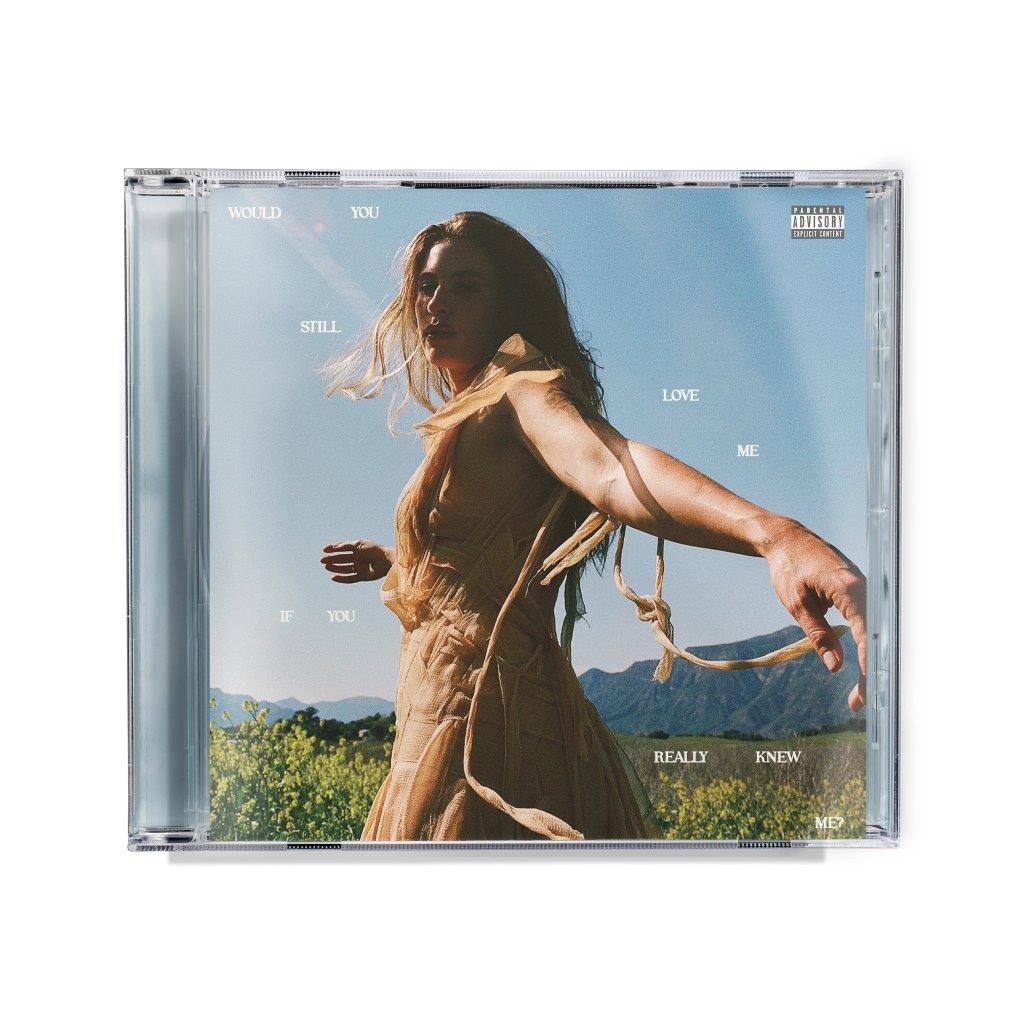 CD case featuring a woman in a flowing dress against a blue sky.