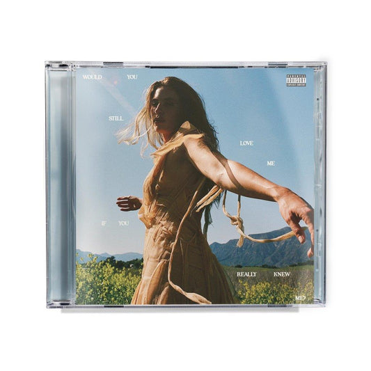 CD case featuring a woman in a flowing dress against a blue sky.