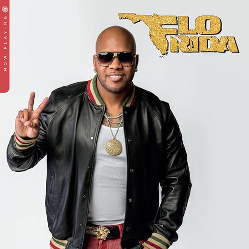 Flo Rida portrait: smiling man in a leather jacket making a peace sign.