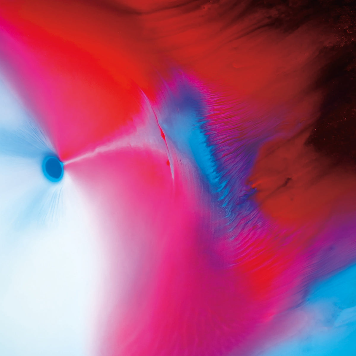 Abstract swirling colors of red, blue, pink, and white paint.