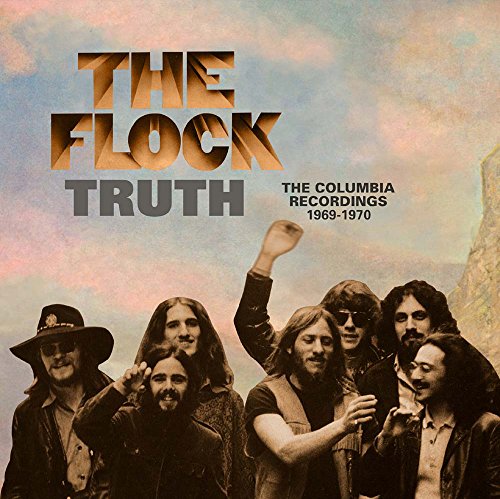 "CD cover featuring a band, The Flock, with a cloudy sky background."