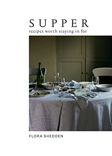 Book cover titled Supper: Recipes Worth Staying in For, featuring a set dinner table.