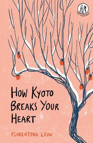 Book cover with a snowy tree and orange fruit against a pink background.