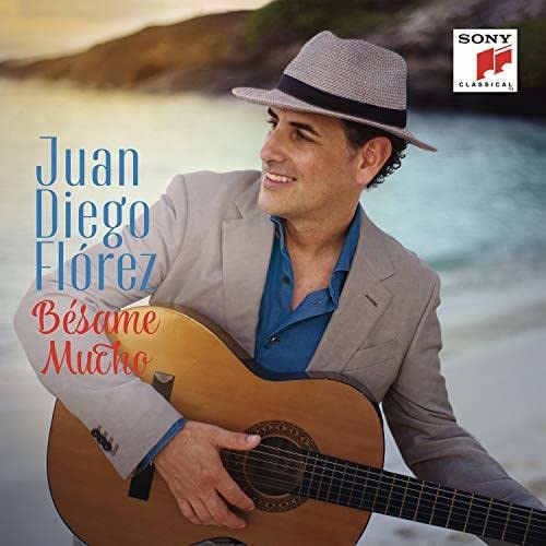 Juan Diego Flórez album cover, man with guitar and hat.