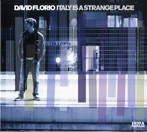 CD cover: man leaning against a fence with abstract colorful stripes.