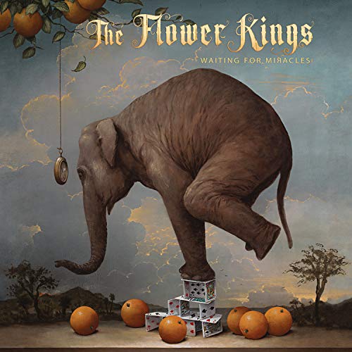 Album cover: an elephant balancing on playing cards with oranges.