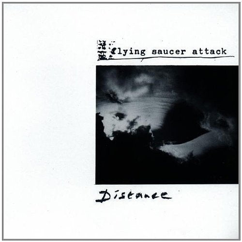"Album cover with blurry black and white image, 'Flying Saucer Attack' and 'Distance' text."
