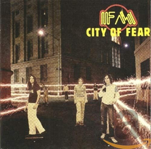 Album cover featuring four band members on a city street with light trails.